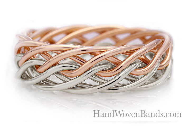 A braided band ring featuring eight intertwined strands of silver and rose gold, set against a reflective white background, with the text "handwovenbands.com" displayed.