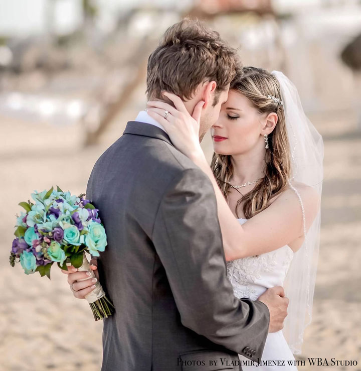 This is a couple in love at their wedding. The exchanged Todd Alan braided wedding rings. The braided rings were a representation of them weaving their lives together. They choose a artistic ring. This picture shows their heads put together as they savor a moment of love