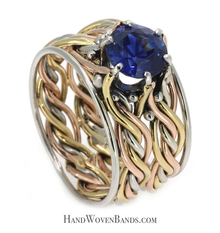 masterpiece-sapphire-gold-ring-braided-unique Braided artistic rings. This is an artisan ring handmade by weaving two rings together and mounting a sapphire. This artist ring is handmade by artist Todd Alan