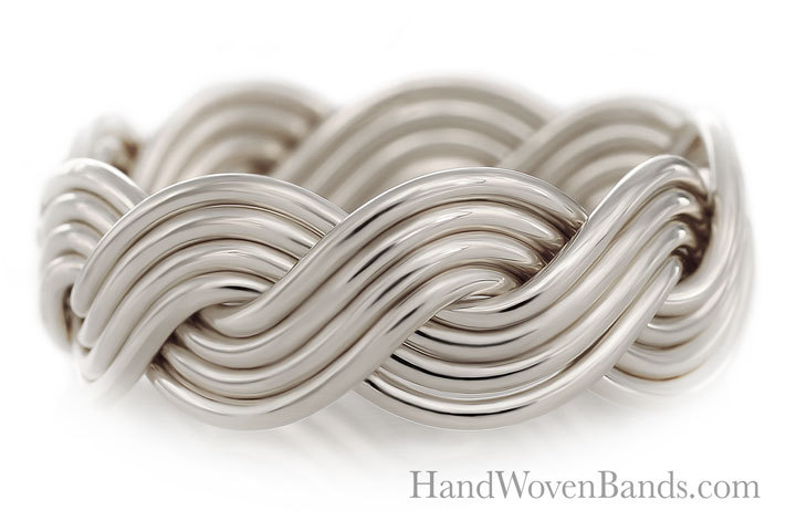 A silver eight-strand closed weave band with an intricate twisting design, isolated on a white background with the text "handwovenbands.com" displayed.