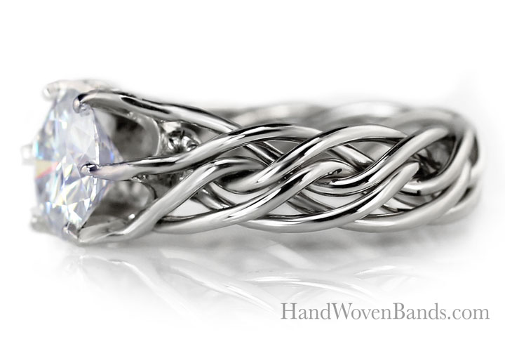 The best example of our custom prong work in platinum and wrapped around the diamond. This is our braided ring handmade and unique.