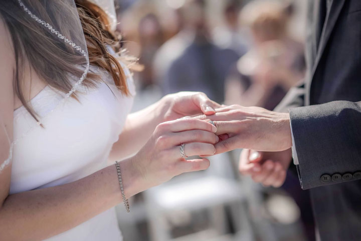 Braided wedding rings handmade by Todd Alan. This is a picture is two of our customers exchanging rings in their wedding ceremony