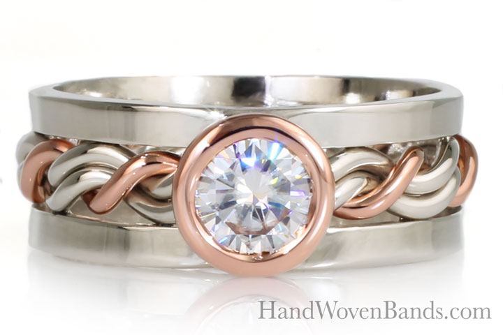 Unique braided ring bezel set with a large diamond. This is a custom made ring made in 14k rose gold and 14k white gold and square outer bands. Handmade braided wedding ring by Todd Alan