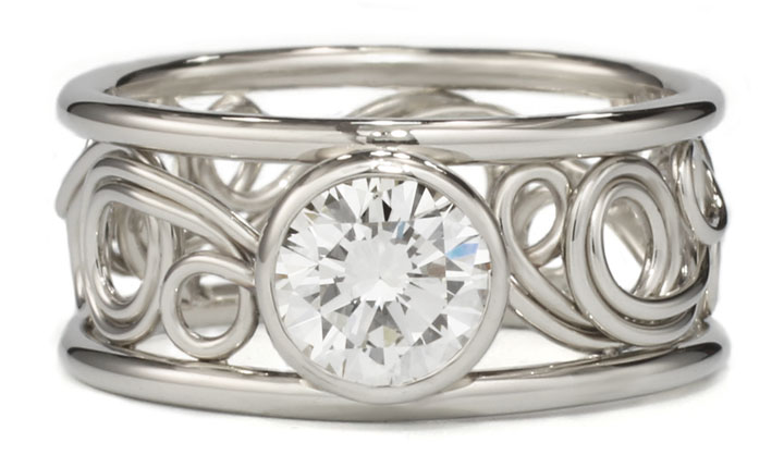 Swirl ring in 14k white gold with a diamond