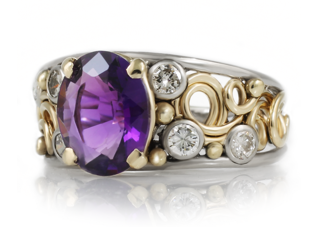 Elegant Mother's Ring featuring a large oval-cut purple gemstone, flanked by intricate gold and silver bands, embellished with several small diamonds.