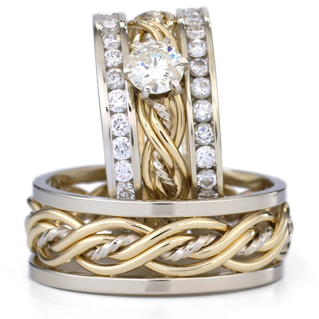 Three gold and diamond rings featuring a solitaire, a band with a twisted design, and a channel-set diamond band.