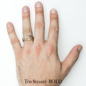 Handwoven braided gold ring on ring finger, unique wedding or engagement ring by Todd Alan, Ten Strand BOLD.