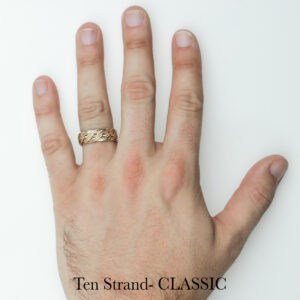 Gold handwoven braided wedding or engagement ring on left hand, unique craftsmanship by Todd Alan. Ten Strand- CLASSIC.