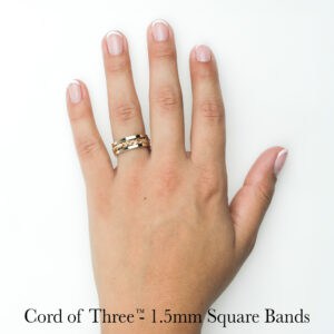 Unique handwoven gold, platinum, and silver ring stack—braided Cord of Three wedding ring by Todd Alan.