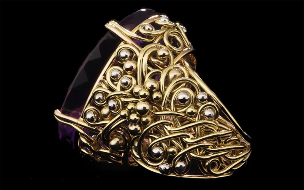 Unique gold handwoven ring with braided wire, metallic beads, and heart-shaped purple gemstone by Todd Alan.