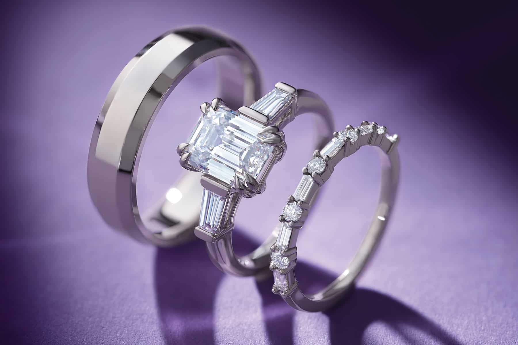 Unique handwoven silver rings: an emerald-cut diamond engagement ring, braided bands, artisan-crafted by Todd Alan.