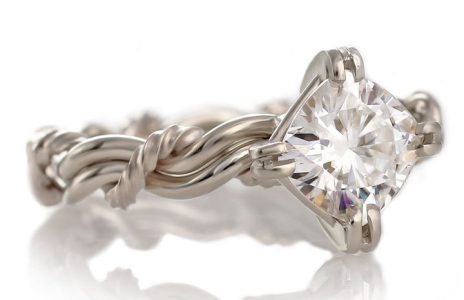 A moissanite ring made with the Christian wedding ring weave known as the cord of three ring. All rings are handmade and braided rings by Todd Alan.